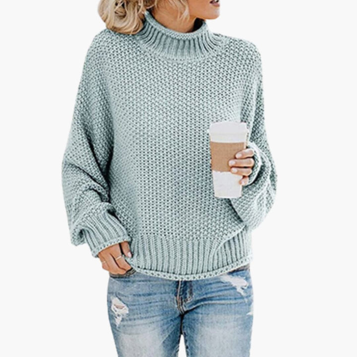 Damen pullover mit hohem Halsausschnitt und geripptem Saum