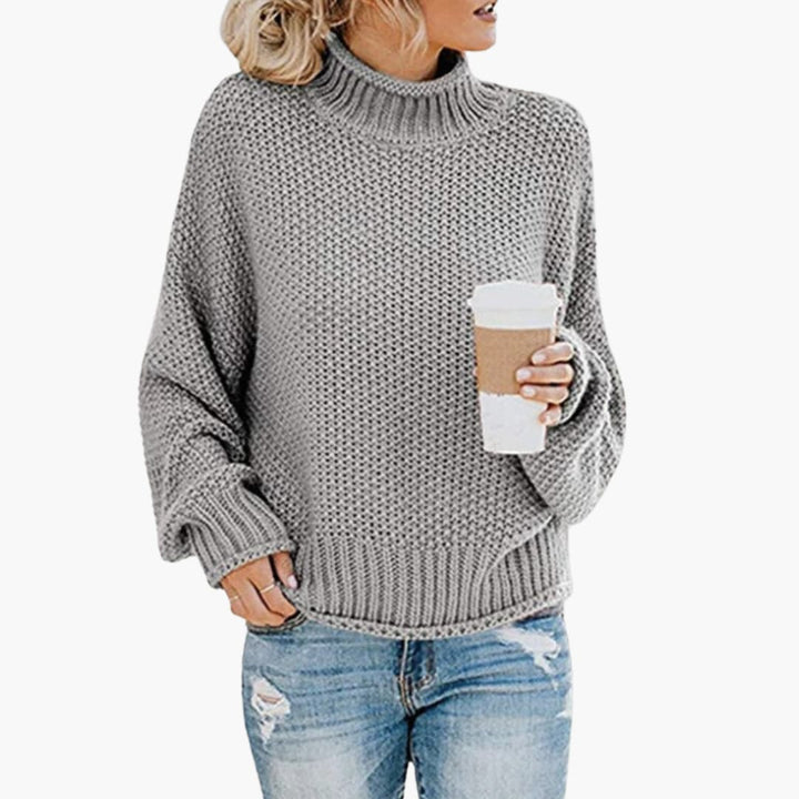 Damen pullover mit hohem Halsausschnitt und geripptem Saum